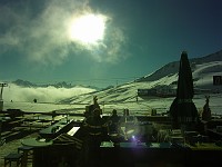  The sun shines on one of the restaurant/bar areas. Shot taken through a ski mask.