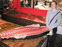  Tokyo fish markets at 7am - Lynn poses with a tuna carcass much to the amusement of locals