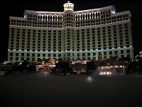  View of the Belagio by night taken from pavement. The fountain show has just finished, and artifical mist settles on the lake.