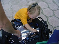  Future cave diver assists with securing backplate (photo by Alex)