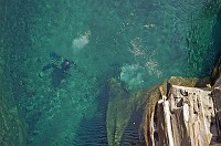  Divers visible under the clear waters of the Roman Bridge